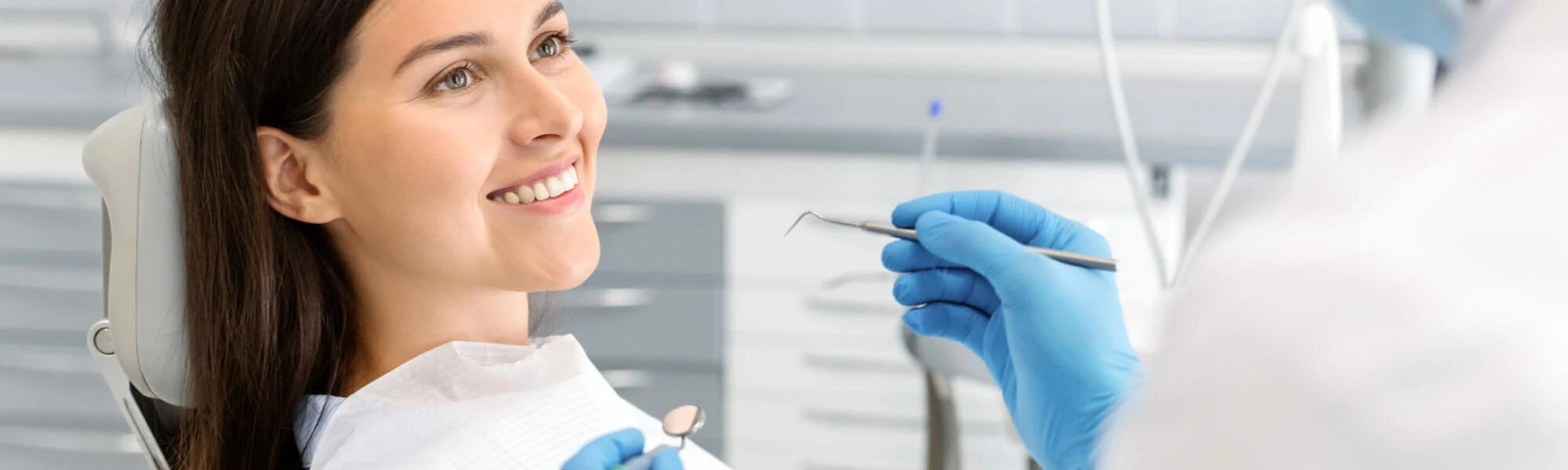 Patient smiling at her dentist